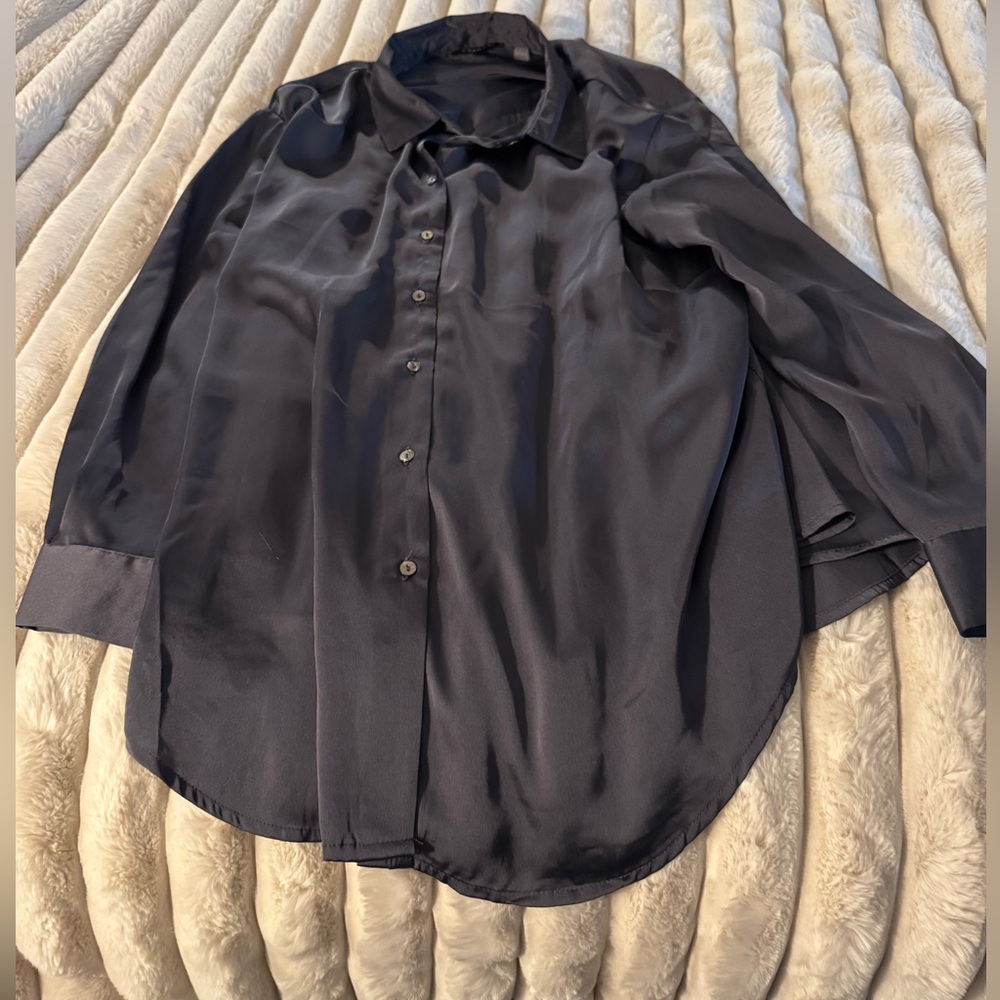 Steel gray/blue color, hangs nice,nice. Long sleeve,shell buttons